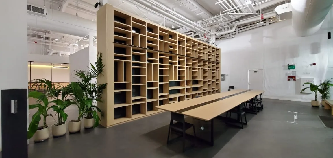 After view of a warehouse library and workspace fit-out.